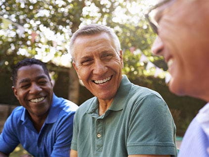 Three happy men talking.