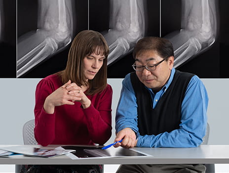 Researchers looking at bone scan.